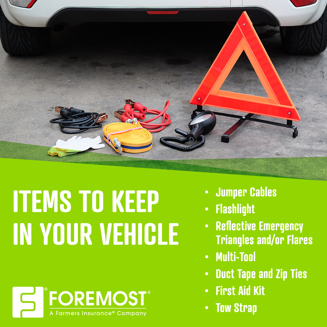 Safety items on the ground next to car