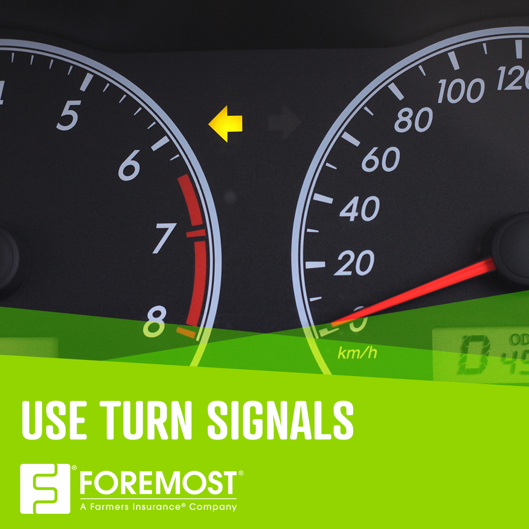 Up-close shot of vehicle dashboard with the left turn signal light on