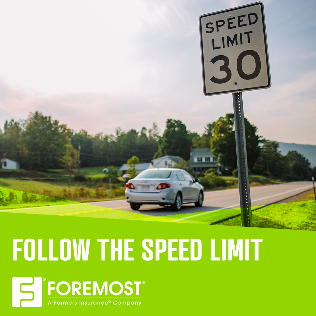 30 MPH speed limit sign with vehicle driving in background