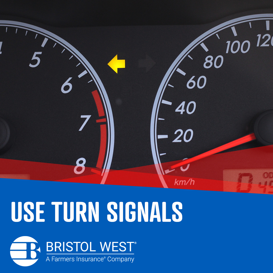 Up-close shot of vehicle dashboard with the left turn signal light on